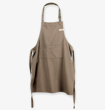 Bild av stilrent och funktionellt förkläde i mullvadsfärg