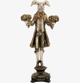 Bild av elegant ljusstake med kanin i guldtoner