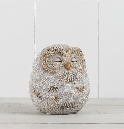 Bild av dekorativ uggla med naturinspirerad design