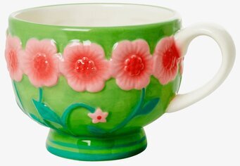 Bild av keramisk mugg med blommotiv och salviagrön ton