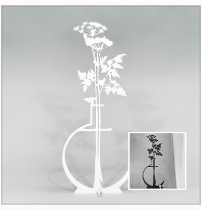 Bild av stiliserad plåtfigur som föreställer en blomma