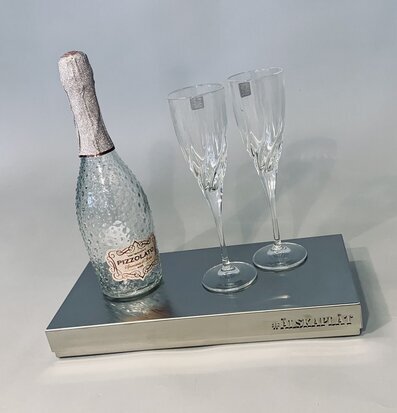 Foto av elegant kylplatta med mousserande vin