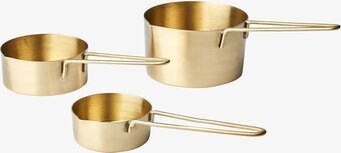 Bild av elegant måttsats i mässing med stilren design