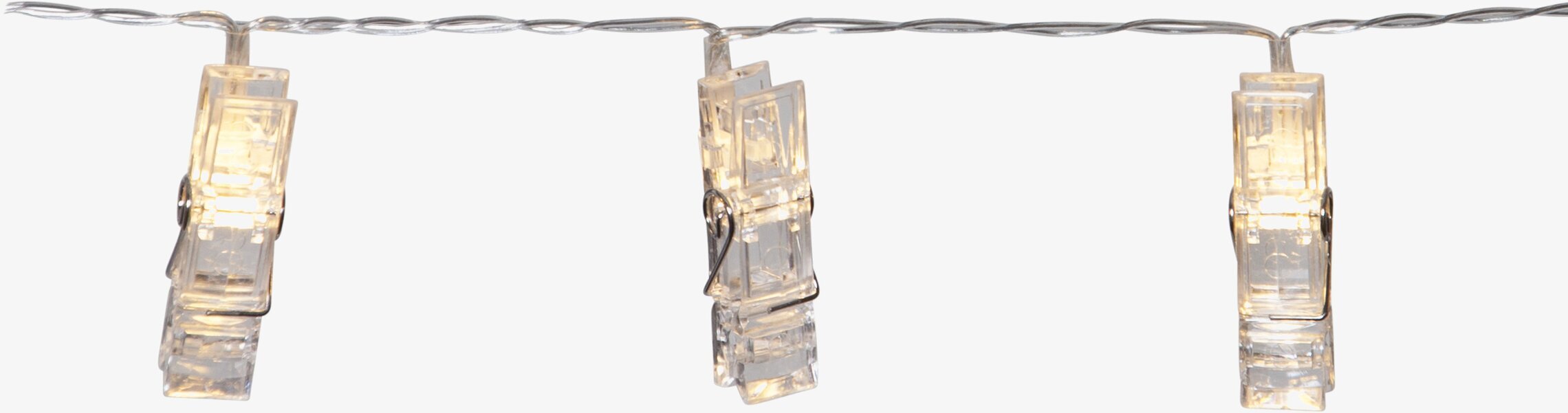 Bild av kreativ ljusslinga med klämmor och varmt ljus