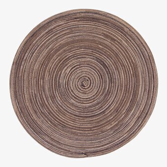 Foto av rund brun tablett med intrikat cirkulär design