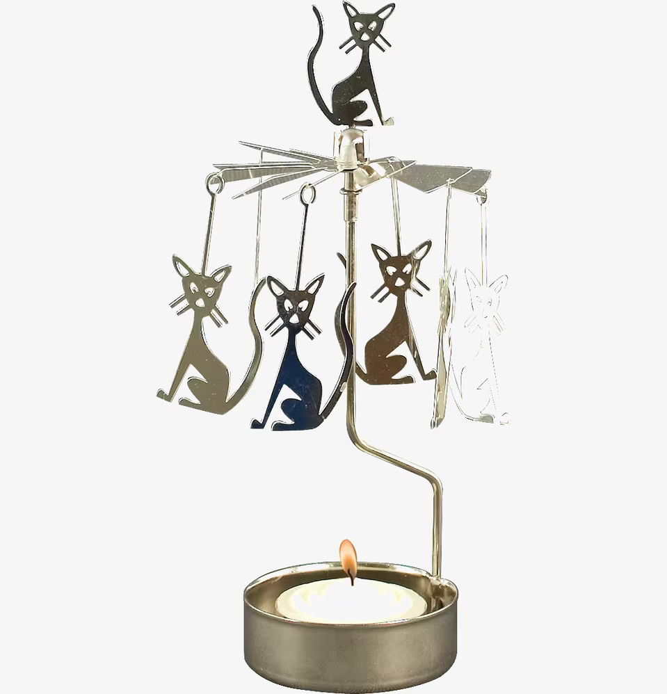 Bild av dekorativt änglaspel med kattmotiv i metall