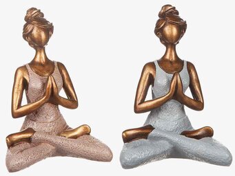 Bild av två detaljerade yogafigurer i lotusposition