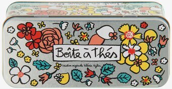 Bild av färgglad plåtburk för tepåsar med blommönster