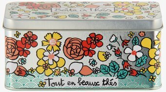 Bild på färgglad plåtburk med blommotiv för tepåsar