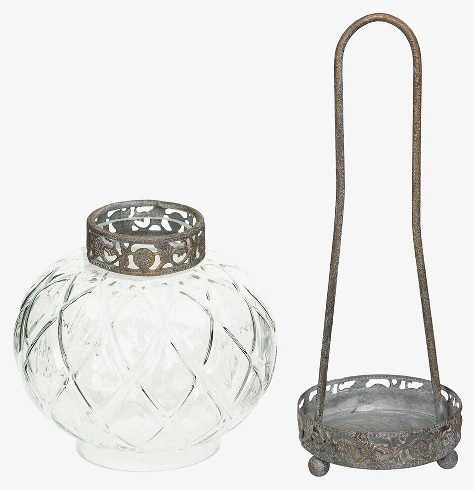 Bild av glaslykta med dekorativ metallkant och hållare