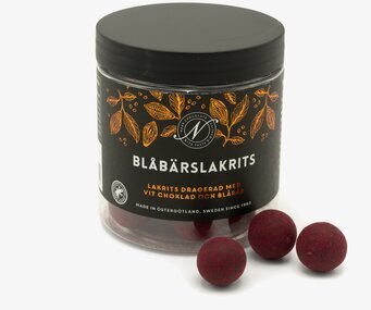 Bild av stilren burk med exklusiv lakrits och choklad