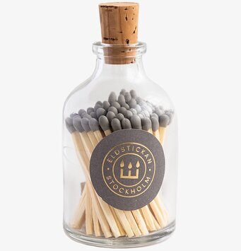 Bild av elegant rund glasburk med tändstickor