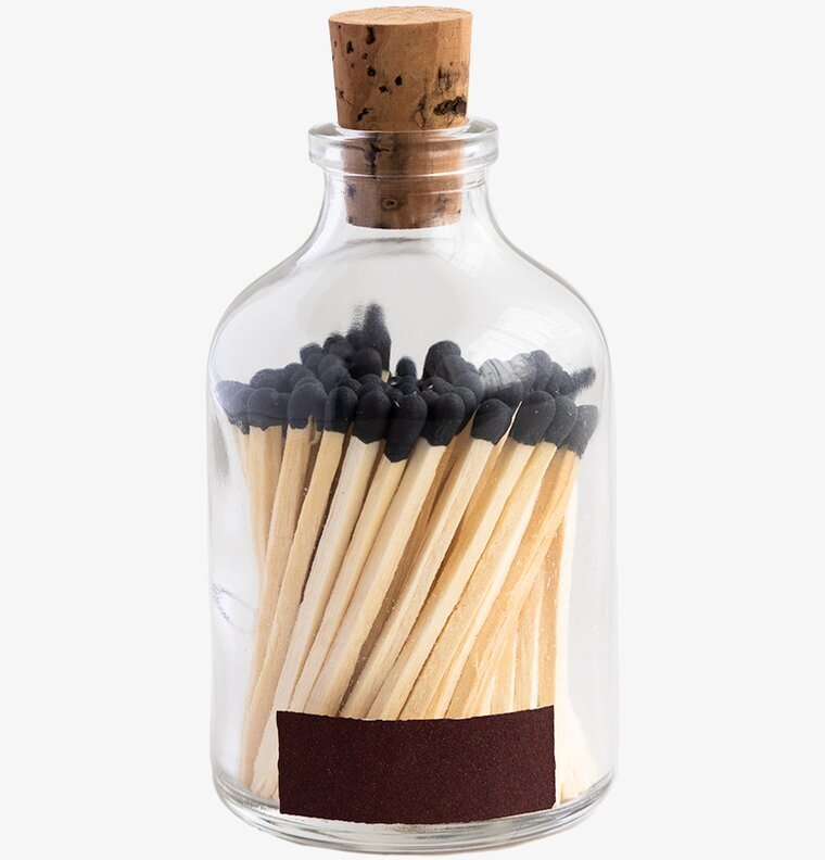 Eldstickan Tändstickor Rund Svart i glasbehållare med kork