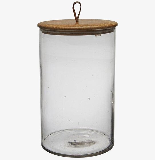 Bild av stor glasburk med trälock och minimalistisk stil