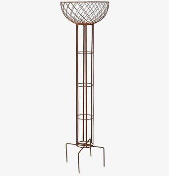 Bild av elegant piedestal för växter i rostbrun design