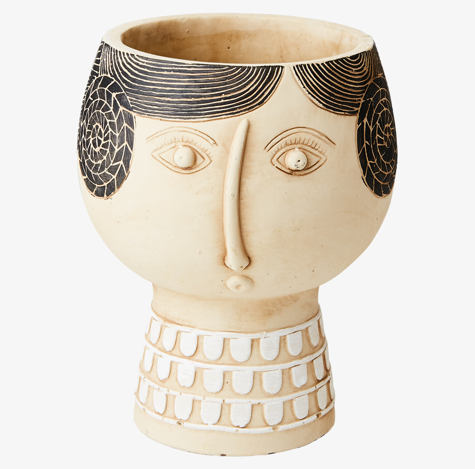 Bild av unik kruka med ansiktsdesign och detaljer