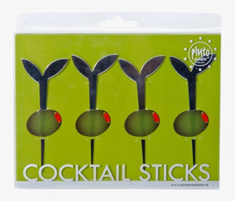 Foto av dekorativa cocktailpinnar i modern förpackning