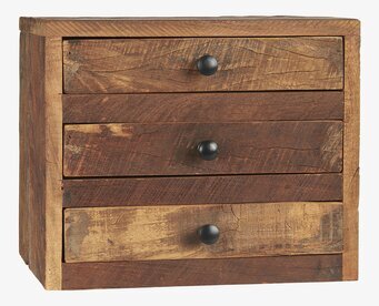 Foto av rustik träbyrå med fyra lådor och mörka knoppar