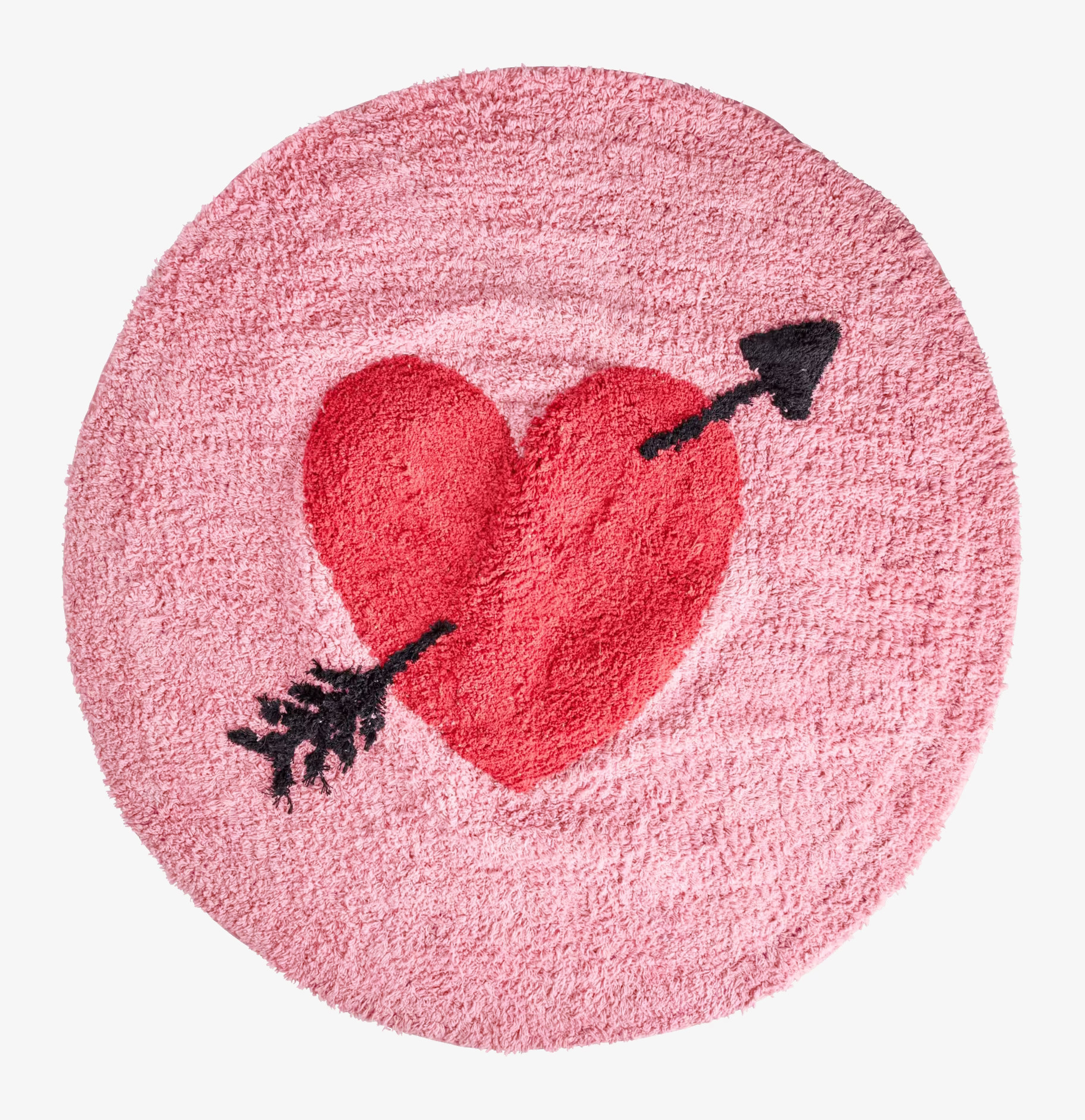 Bild av rund matta med rött hjärta och pil