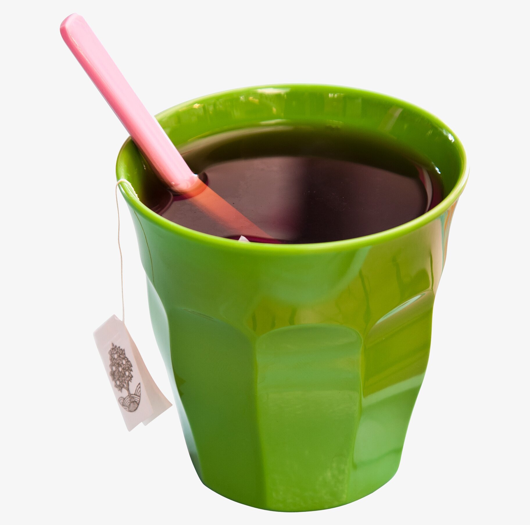 Bild av livfull grön mugg med rosa sked och teetikett