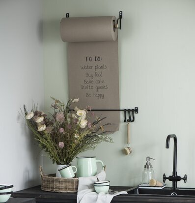 Foto av hemtrevligt och välordnat kök med stilren design