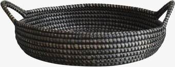 Foto av elegant och funktionell rund bricka med handtag