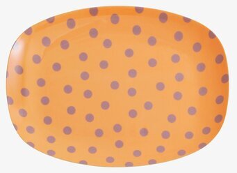 Bild av tallrik med lavendelprickar på orange botten