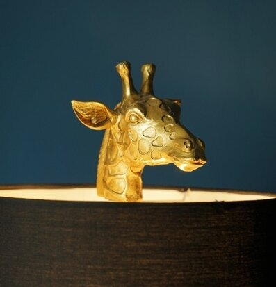 Bild av en unik och fascinerande lampa i guld och svart