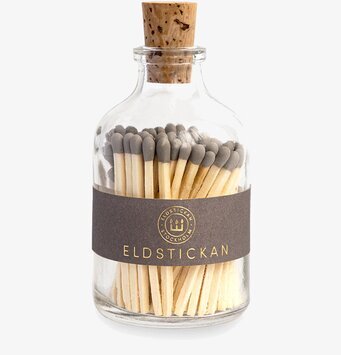 Bild av elegant rund glasbehållare med tändstickor