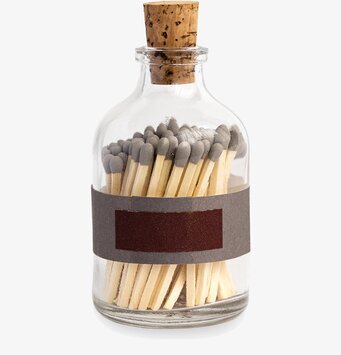 Bild av glasburk med tändstickor och korkförslutning