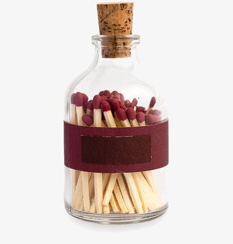 Bild av dekorativ glasburk med eleganta tändstickor