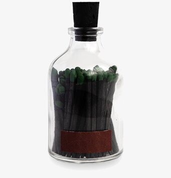 Foto av stilren glasburk med eleganta tändstickor