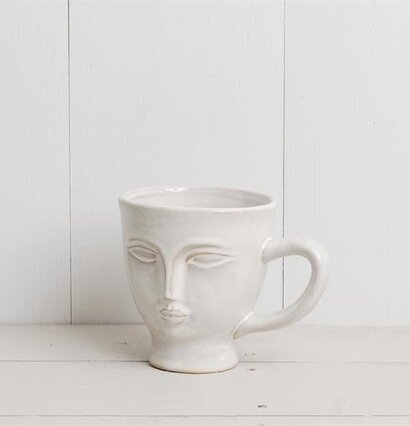Bild av unik vit mugg med konstnärlig ansiktsdesign