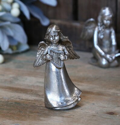 Bild av antik silverängel med harpa och lövverk