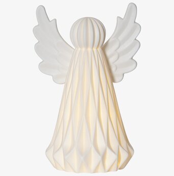 Foto av stilren ängel som bordsdekoration i vinter