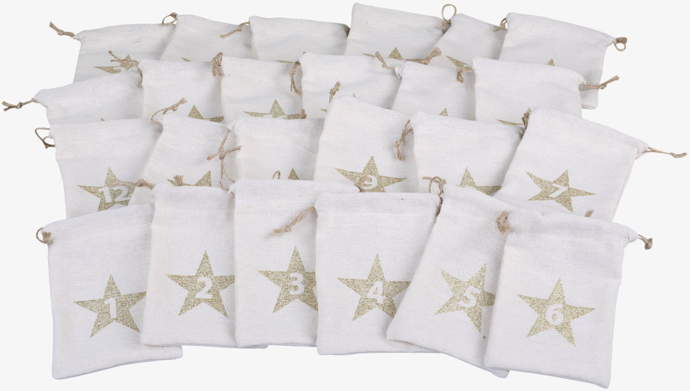 Bild av adventspåsar i vitt med gyllene stjärnor