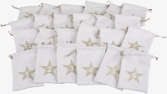 Bild av adventspåsar i vitt med gyllene stjärnor