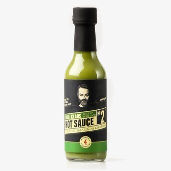 Bild av elegant flaska med grön hot sauce