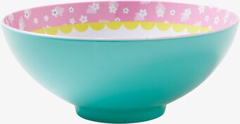 Bild av färgglad skål med blommönster och turkos yta