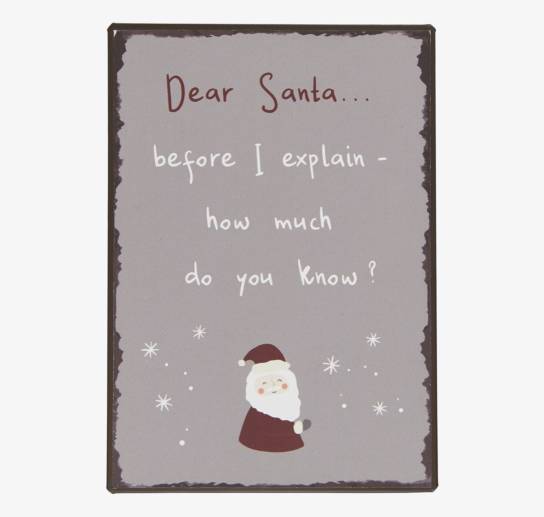 Bild av humoristisk julskylt med tomte och stjärnor