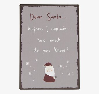 Bild av humoristisk julskylt med tomte och stjärnor