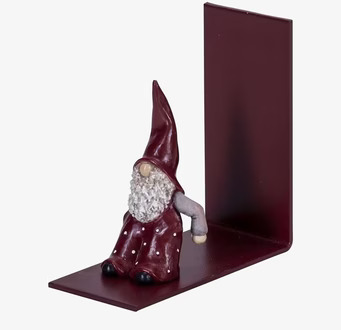 Bild på servetthållare med tomtefigur i vinröd färg