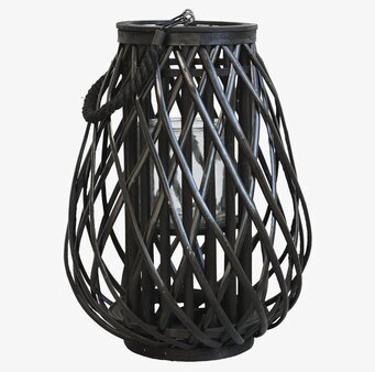 Bild av elegant svart flätad lanterna i pilträd