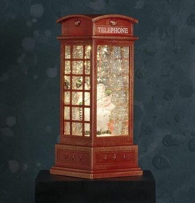 Bild av snöglob: klassisk telefonkiosk och snögubbe