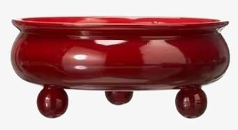 Foto av elegant planteringsskål i röd glansig finish