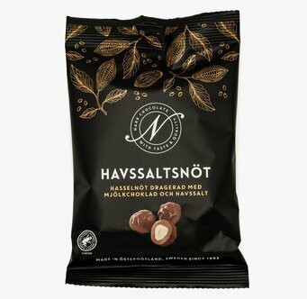 Bild av elegant förpackning med chokladdragerade nötter
