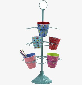 Bild av färgglatt turkost muggstativ med livfull design