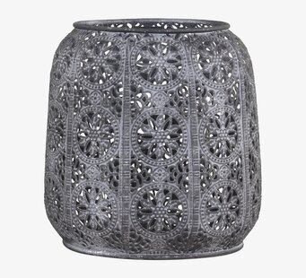 Foto av ljuslykta i antikbehandlad zink med mönster