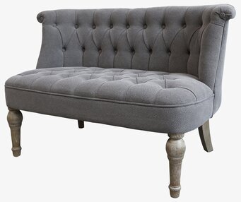 Bild av elegant och stilren soffa med tuftat ryggstöd