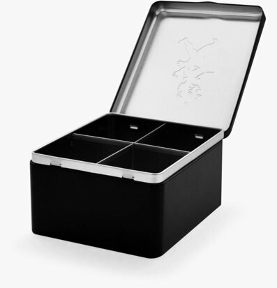 Bild av stilren plåtburk med fyra fack för förvaring